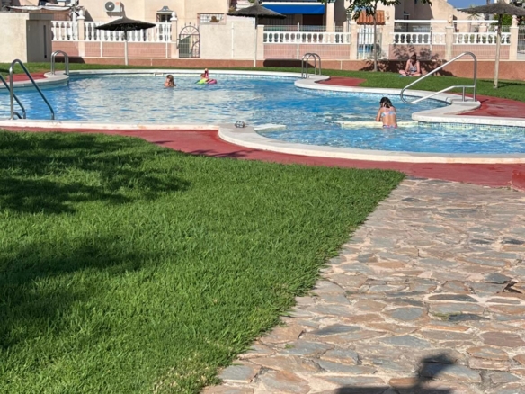 Corner townhouse with large patio and communal pool in Playa Flamenca, Orihuela Costa