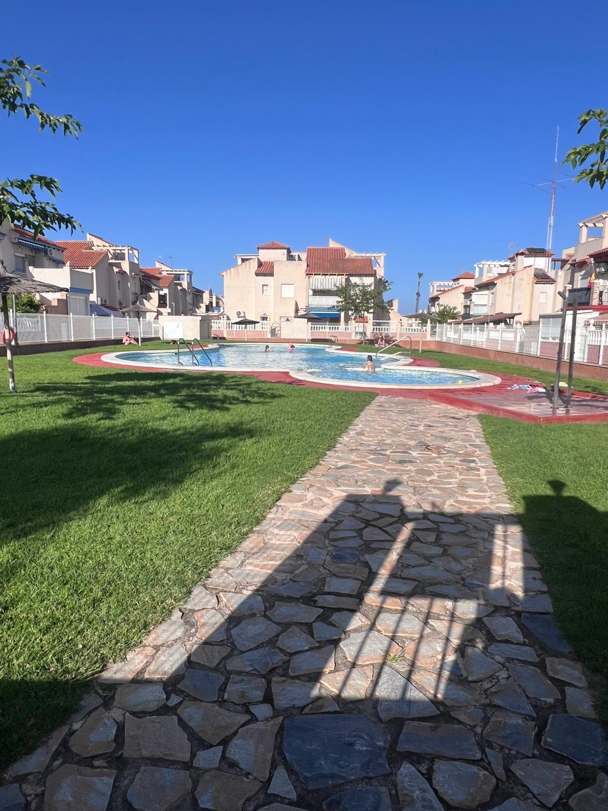 Corner townhouse with large patio and communal pool in Playa Flamenca, Orihuela Costa